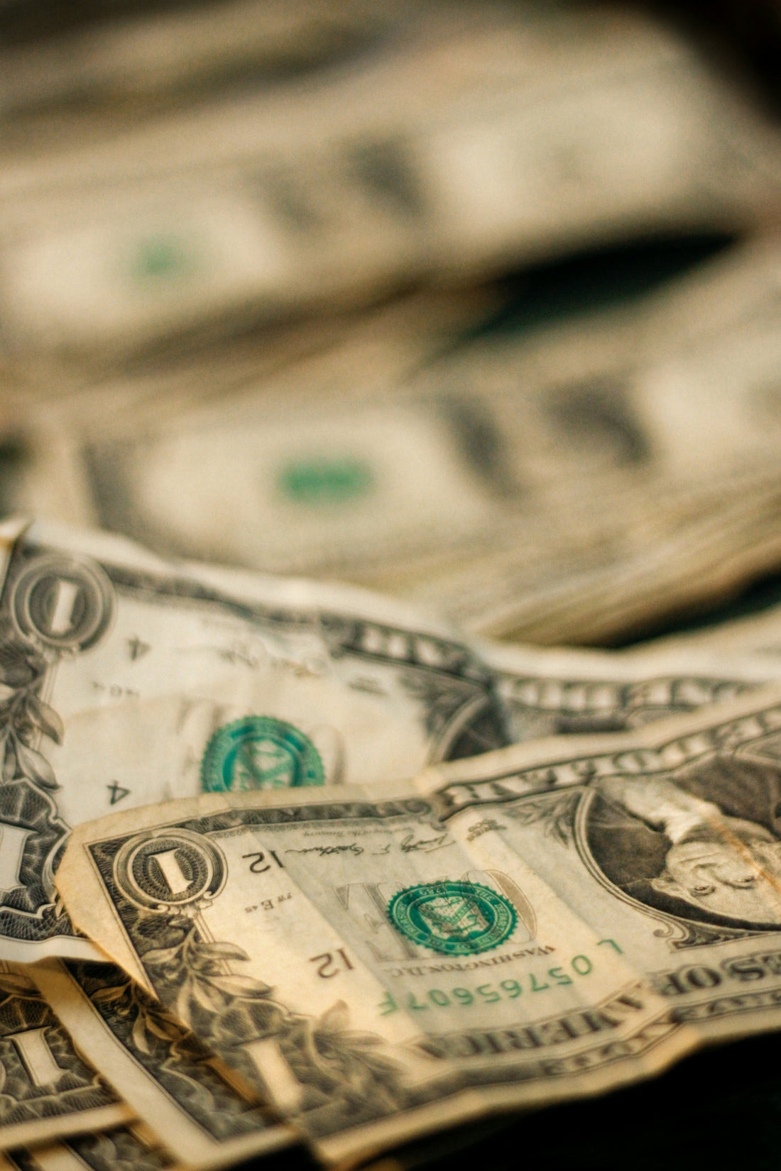 shallow focus photography of U.S. dollar banknotes